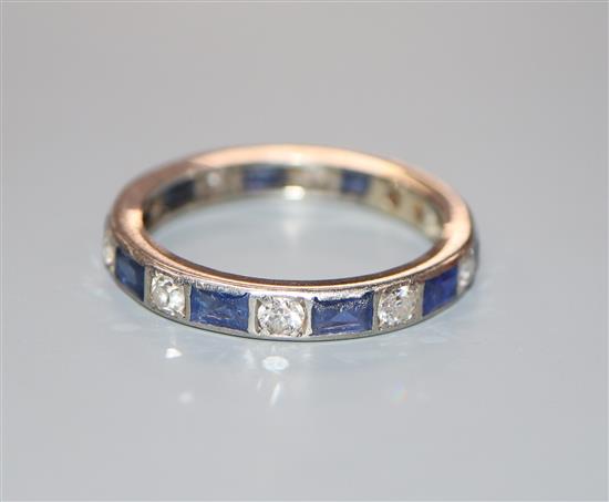 A white metal, sapphire and diamond set full eternity ring, size U/V.